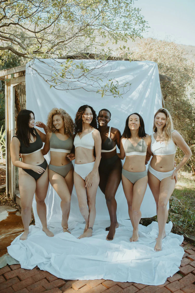 A group of women modeling bras and underwear