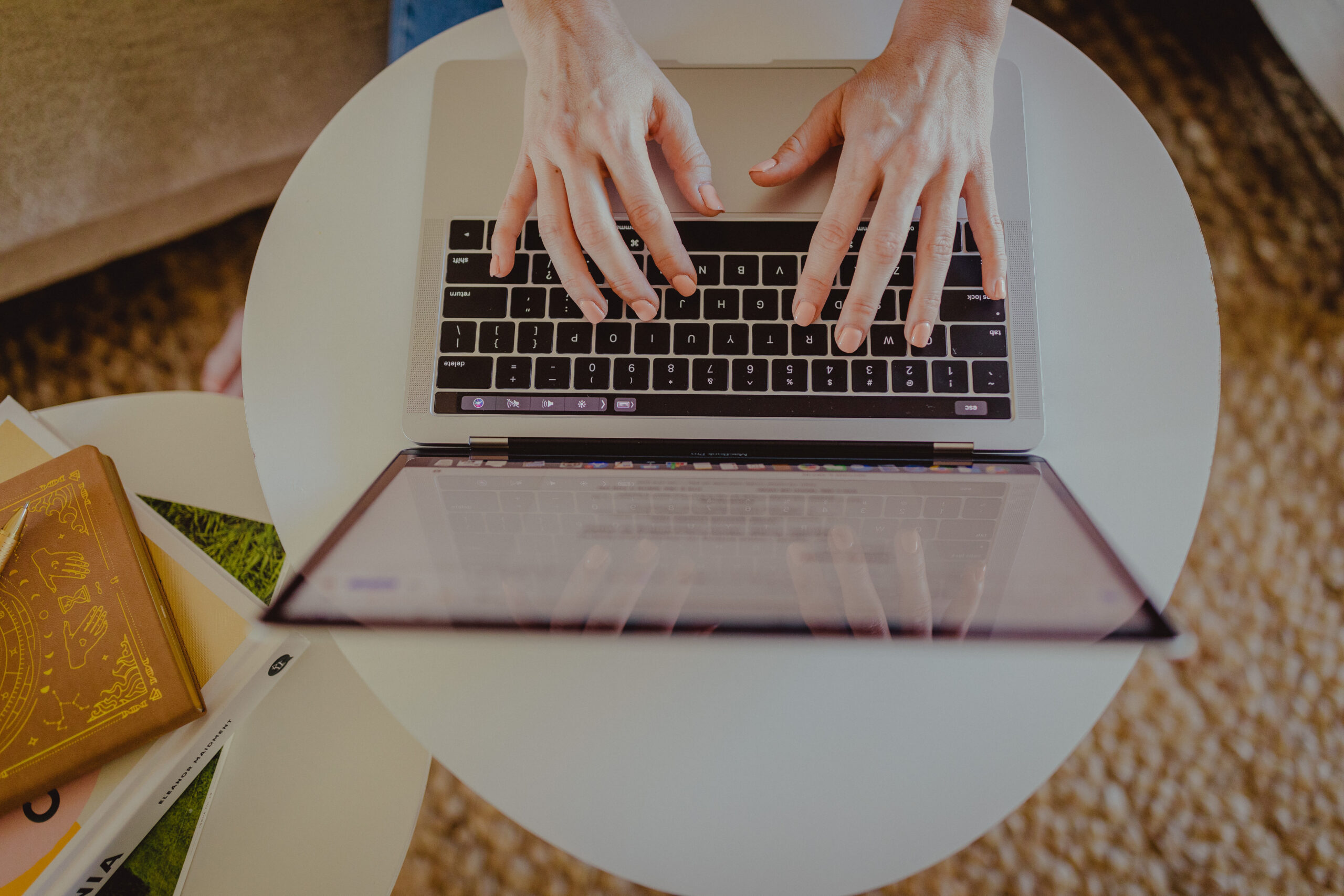 A website copywriter typing on a keyword, writing a blog for business owners who want to learn copywriting 101 for beginners